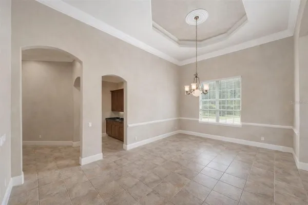 a kitchen with stainless steel appliances granite countertop a sink and a refrigerator