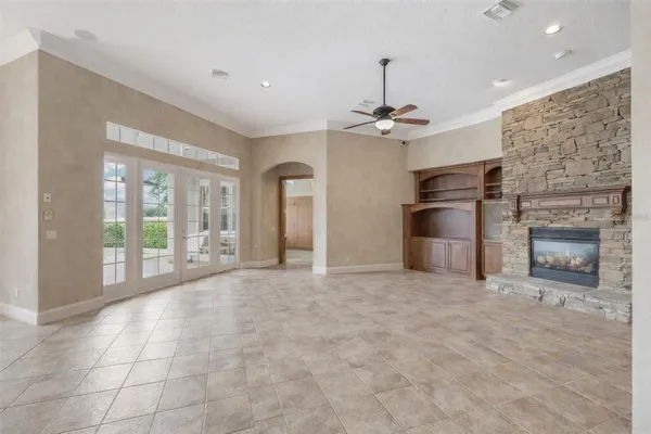 a large kitchen with kitchen island a sink stainless steel appliances and a counter space