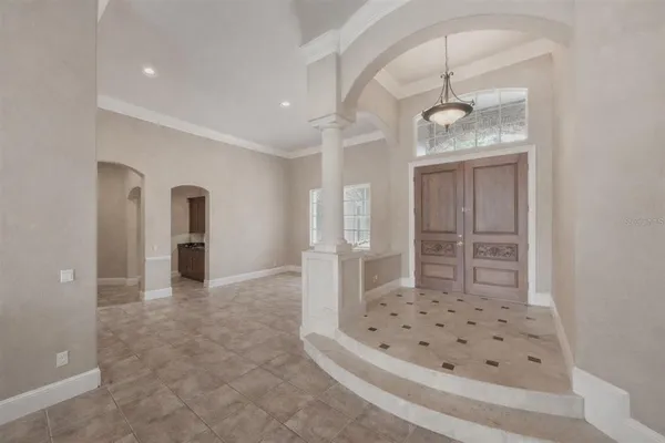 a view of an empty room with a window