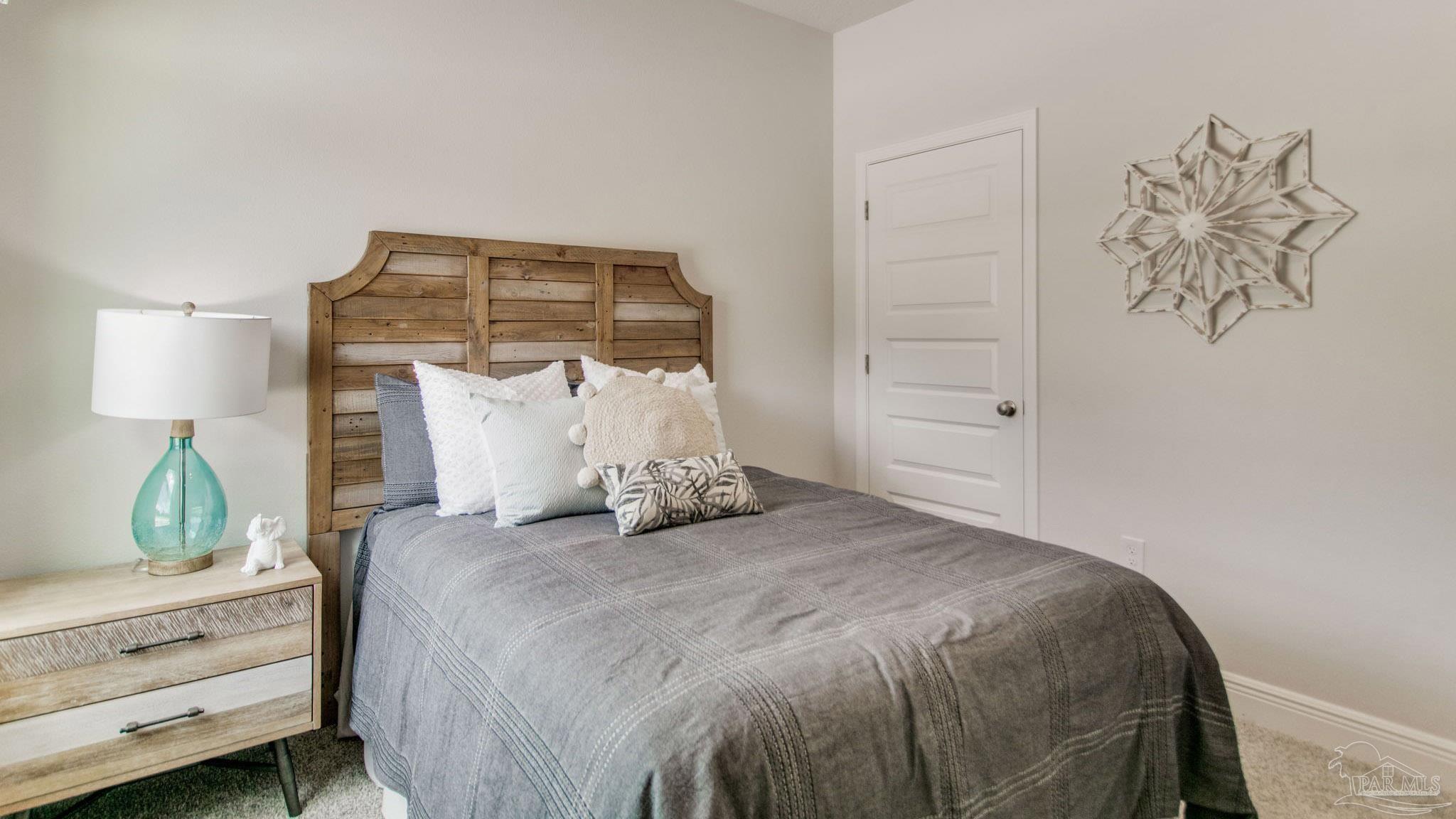 8650 Russellcross Boulevard Pensacola, FL 32507 - Photo 26 of 28 a bedroom with a bed and lamp