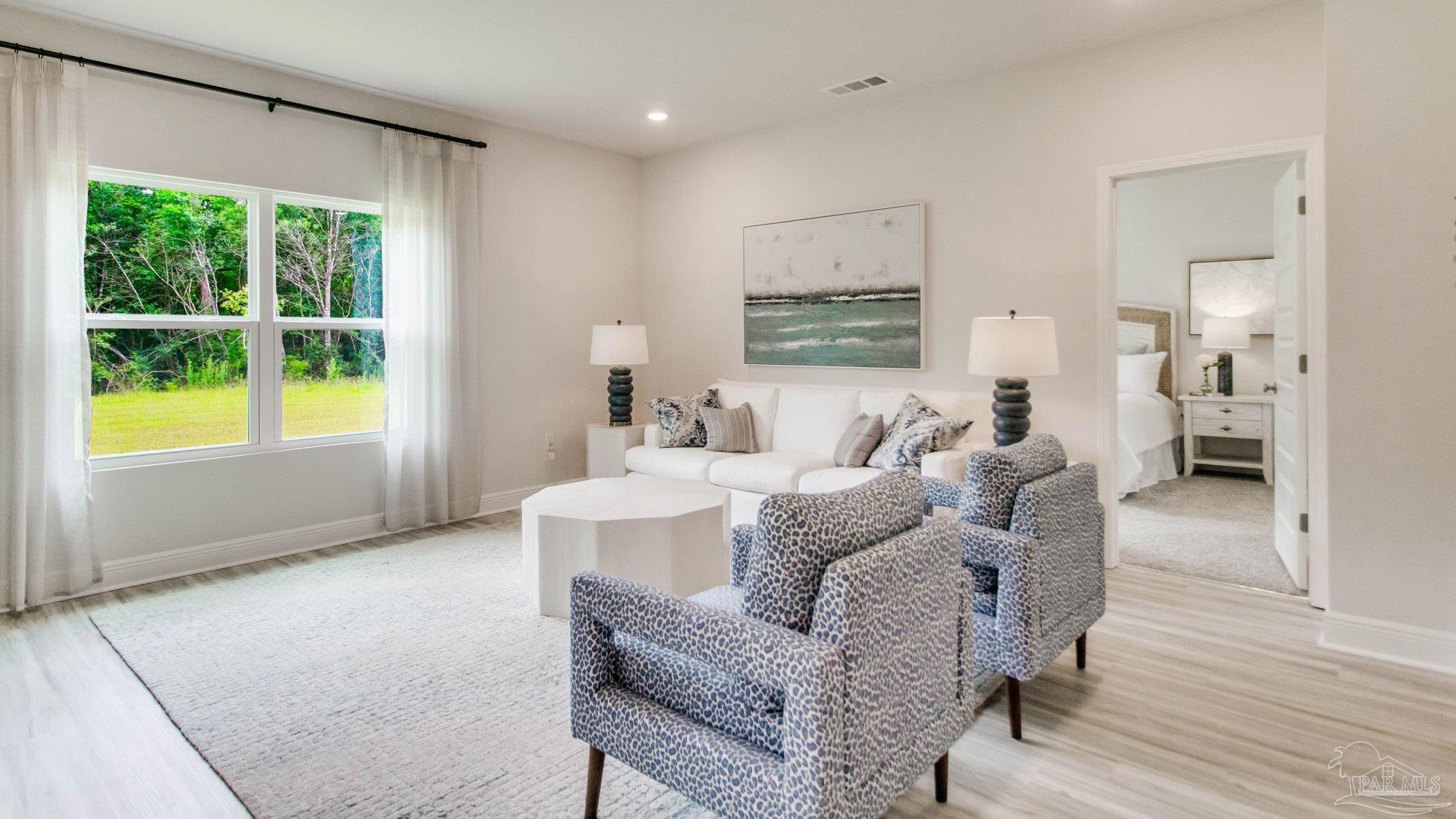 8650 Russellcross Boulevard Pensacola, FL 32507 - Photo 9 of 28 a living room with furniture and a window
