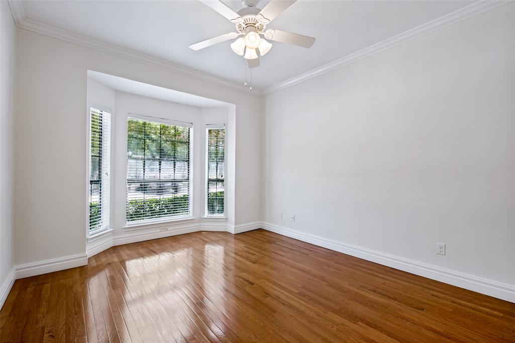 7055 Inwood Road Dallas, TX 75209 - Photo 17 of 24 a view of an empty room with window and wooden floor