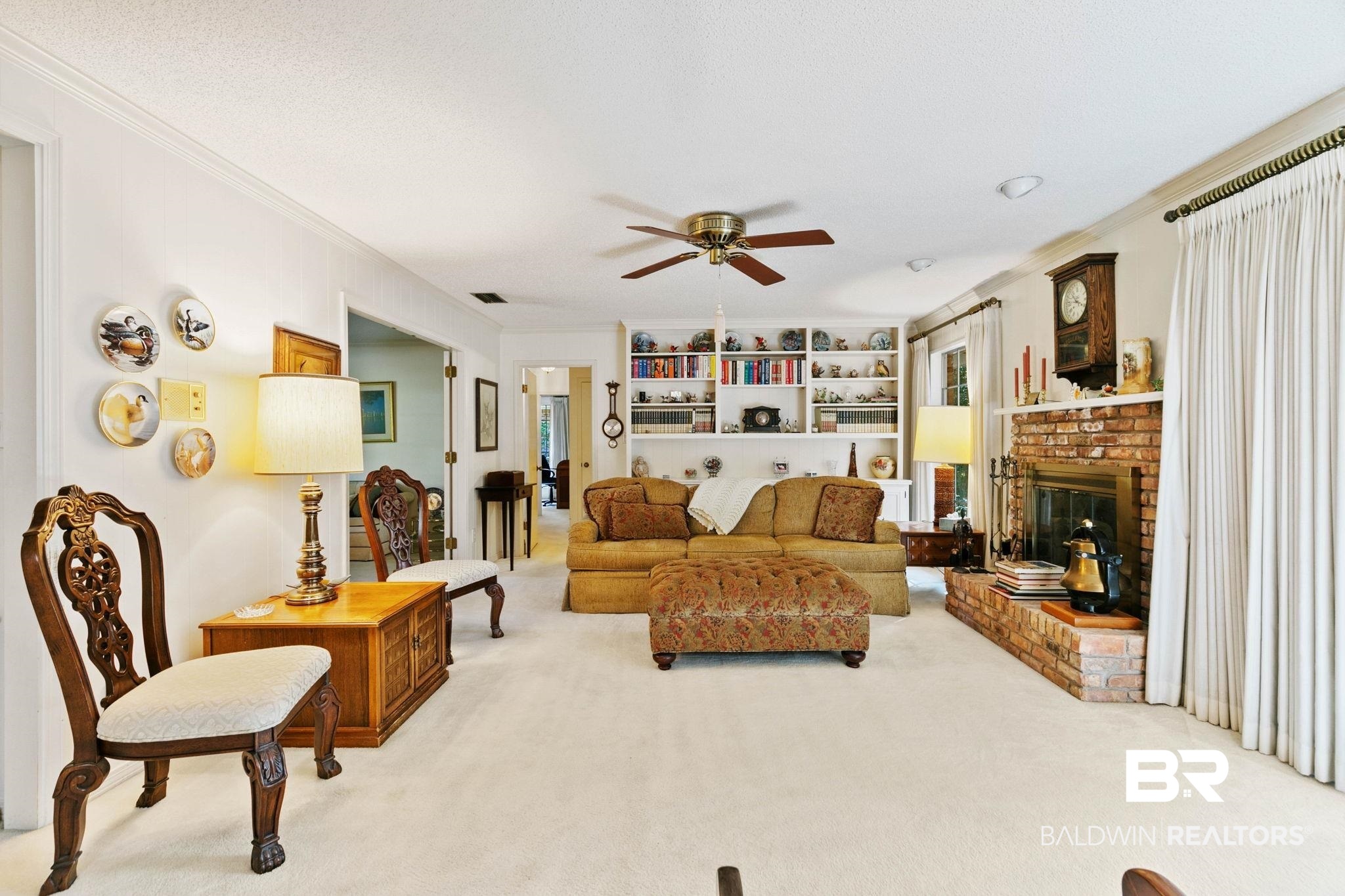 752 Evergreen Street Fairhope, AL 36532 - Photo 6 of 100 Living area with ornamental molding, carpet, a fireplace, and ceiling fan