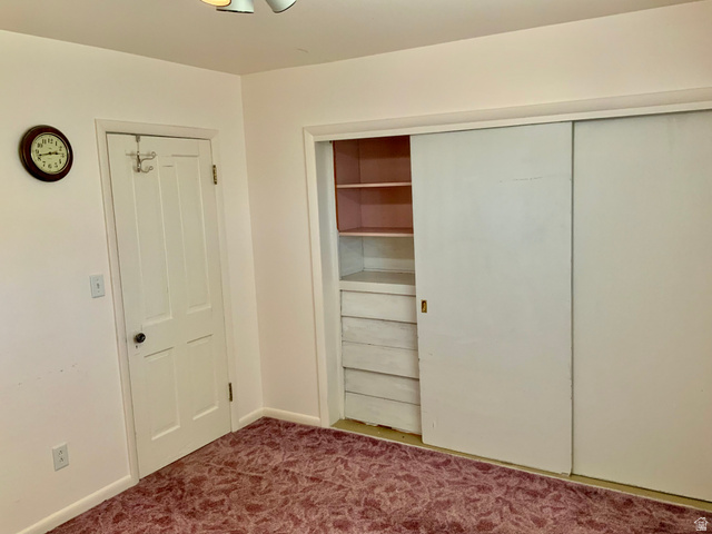 630 North Main Street Monroe, UT 84754 - Photo 16 of 63 Unfurnished bedroom featuring dark carpet and baseboards