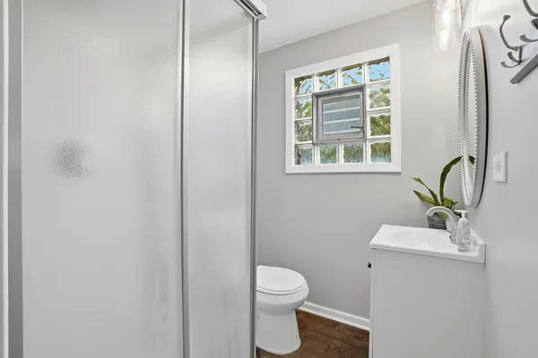 a bedroom with furniture and a window