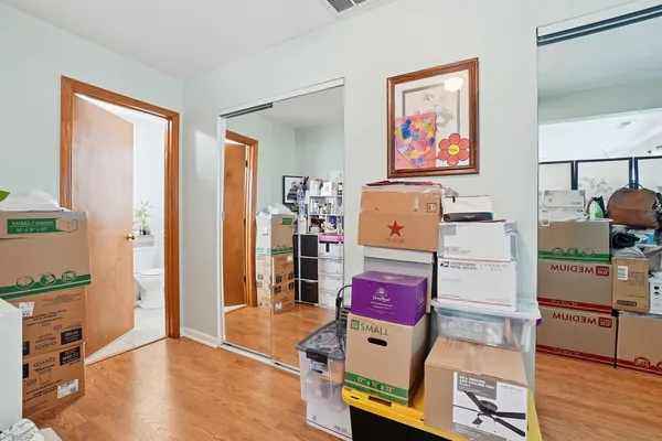 a bedroom that has a bed and a table in it