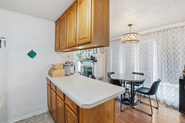a kitchen that has a table and chairs in it