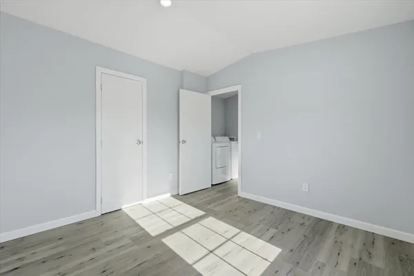 an empty room with wooden floor