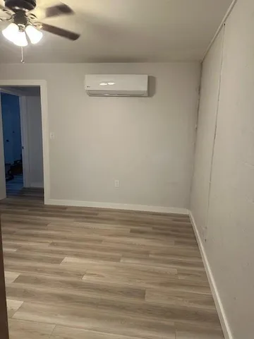 a view of a small space with wooden floor