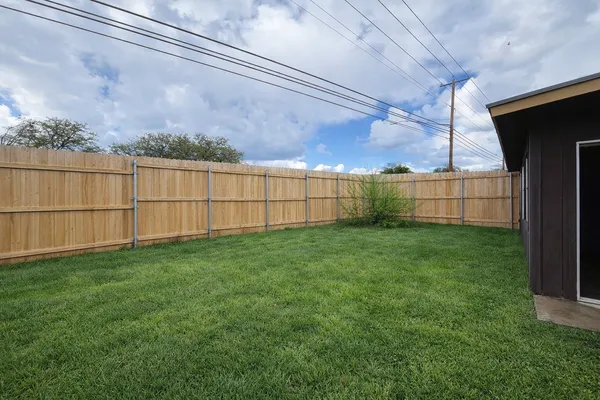 a view of backyard with green space
