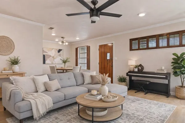 a living room with furniture and a table