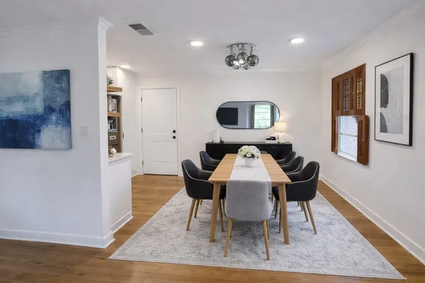 a workspace with furniture and a wooden floor