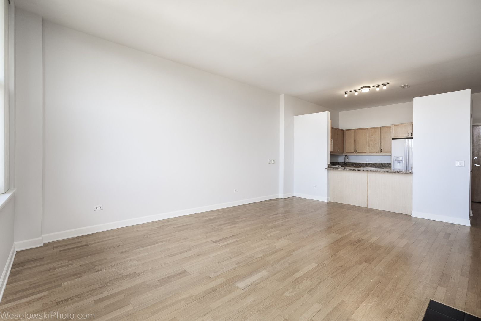 15 South Throop Street, Unit 503 Chicago, IL 60607 - Photo 8 of 20 a view of a kitchen with a sink and a refrigerator
