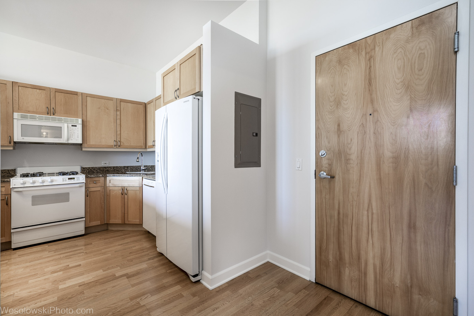 15 South Throop Street, Unit 503 Chicago, IL 60607 - Photo 10 of 20 a kitchen with stainless steel appliances granite countertop a refrigerator and a stove top oven
