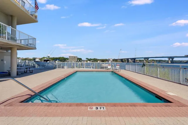 a view of a swimming pool and an outdoor seating
