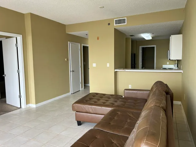 a living room with a bed and furniture