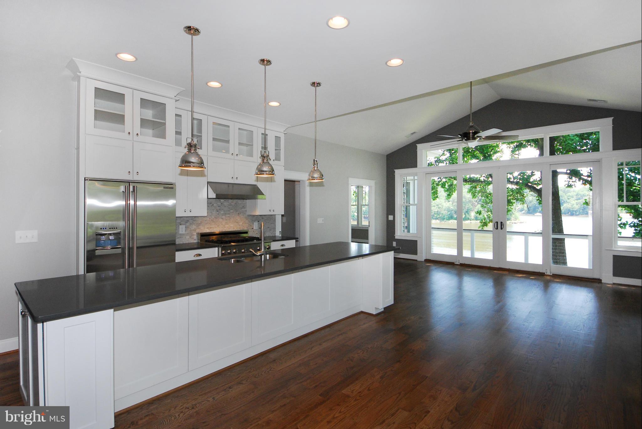 Great room & gourmet kitchen with quartz counters