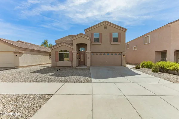 a front view of a house with a garage