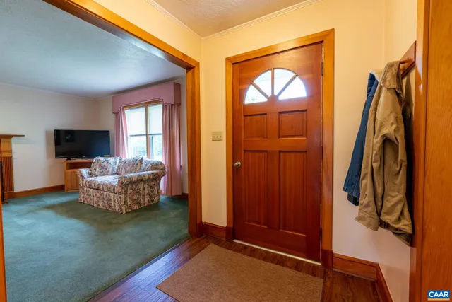 a bedroom with furniture and a potted plant
