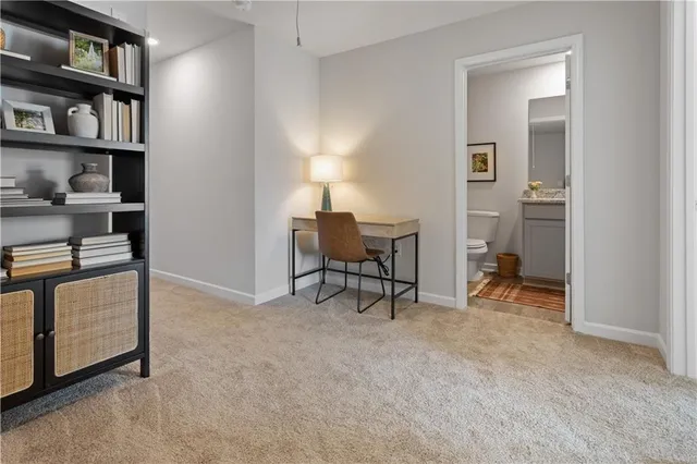 a view of room with workspace and window