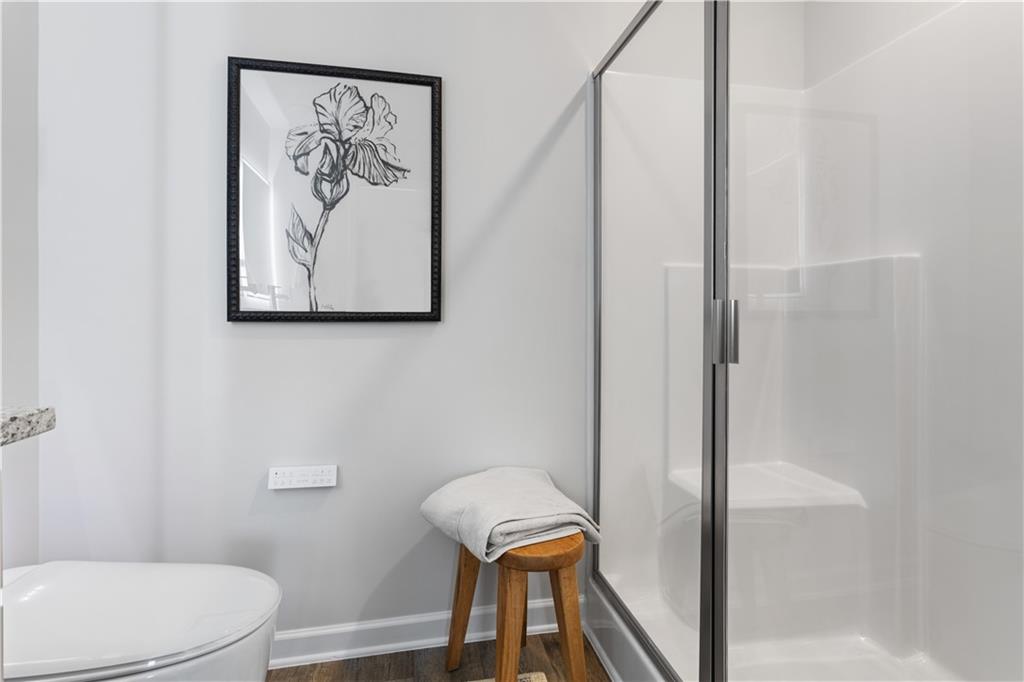 118 Meadowview Drive, Unit 9 Temple, GA 30179 - Photo 23 of 25 a bathroom with a toilet and a shower