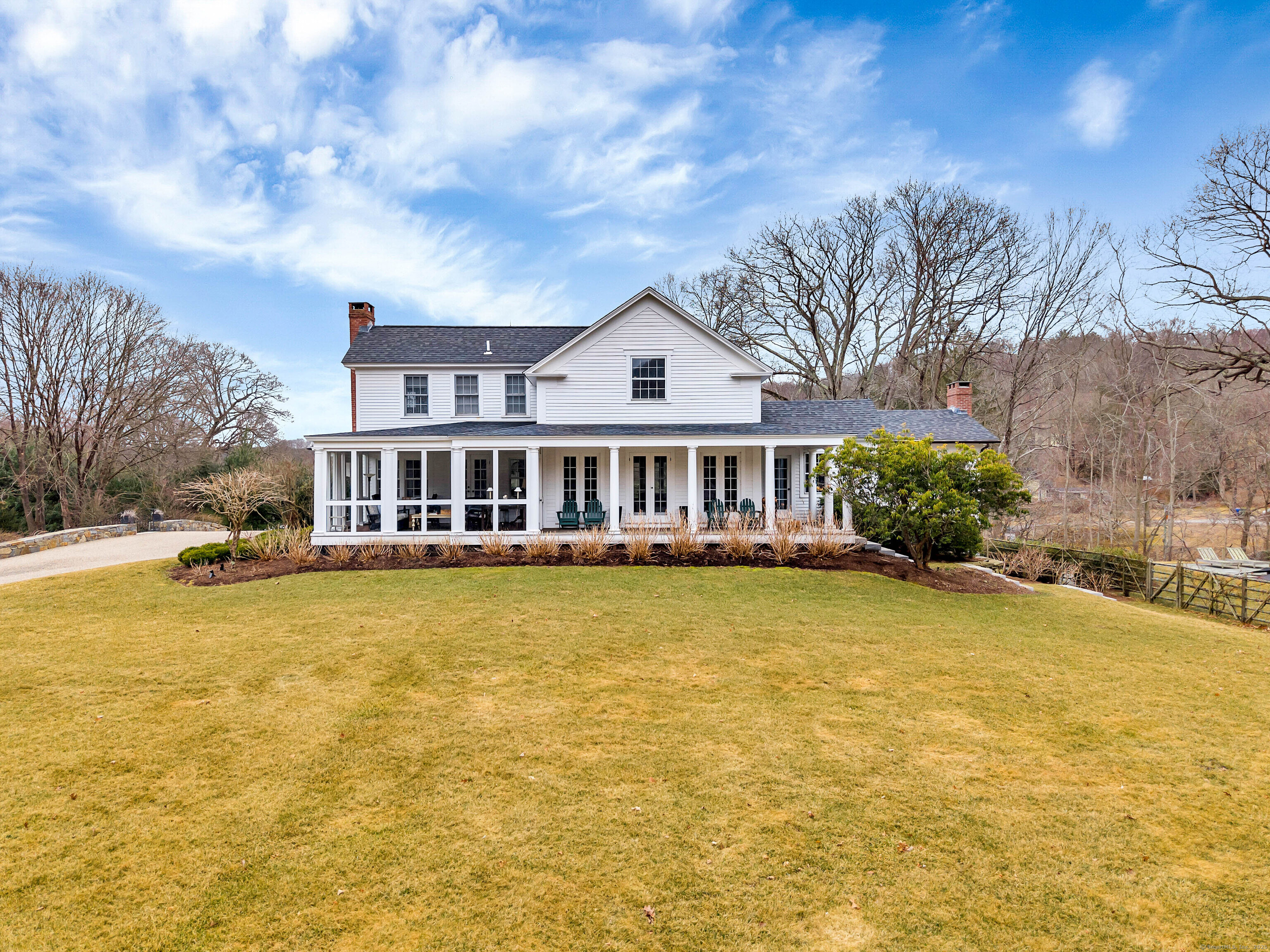 a front view of house with yard and swimming pool