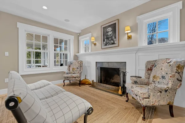 a living room with furniture and a fireplace