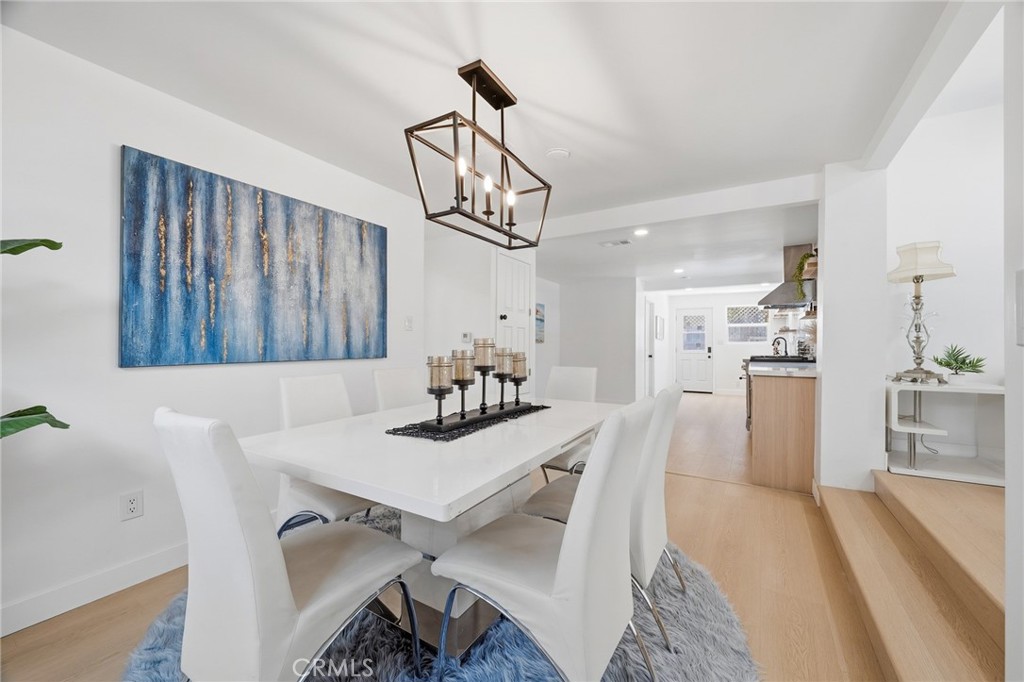 1280 East Woodbury Road Pasadena, CA 91104 - Photo 14 of 40 a view of a dining room with furniture and wooden floor