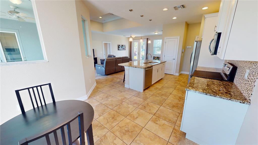 7342 North Ficus Tree Punta Gorda, FL 33955 - Photo 12 of 34 a large white kitchen with a large window