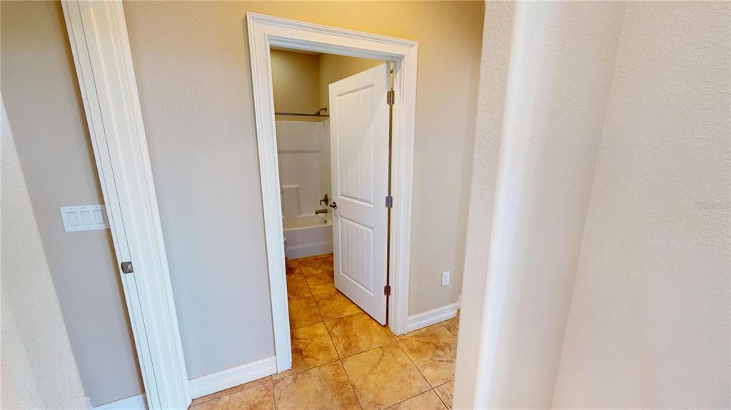 7342 North Ficus Tree Punta Gorda, FL 33955 - Photo 20 of 34 a view of a bathroom from a hallway