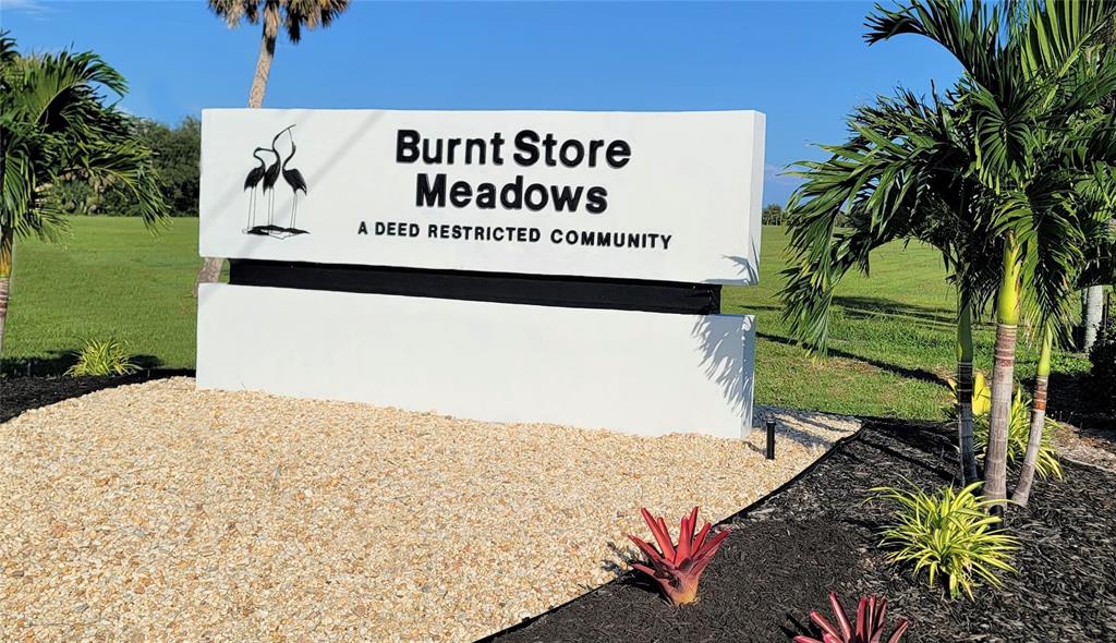 7342 North Ficus Tree Punta Gorda, FL 33955 - Photo 33 of 34 a sign on the side of a road