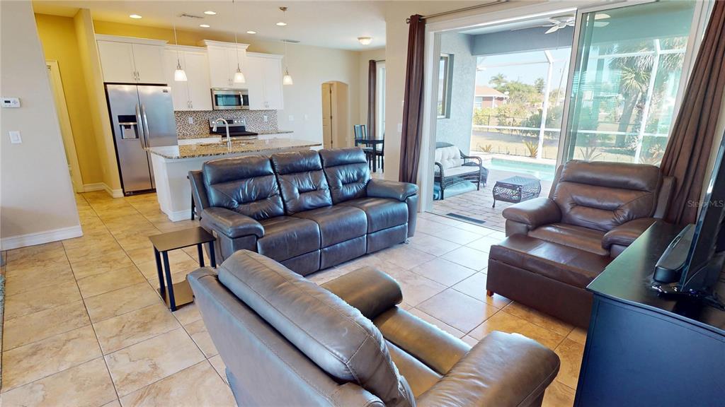 7342 North Ficus Tree Punta Gorda, FL 33955 - Photo 7 of 34 a living room with stainless steel appliances furniture and a large window