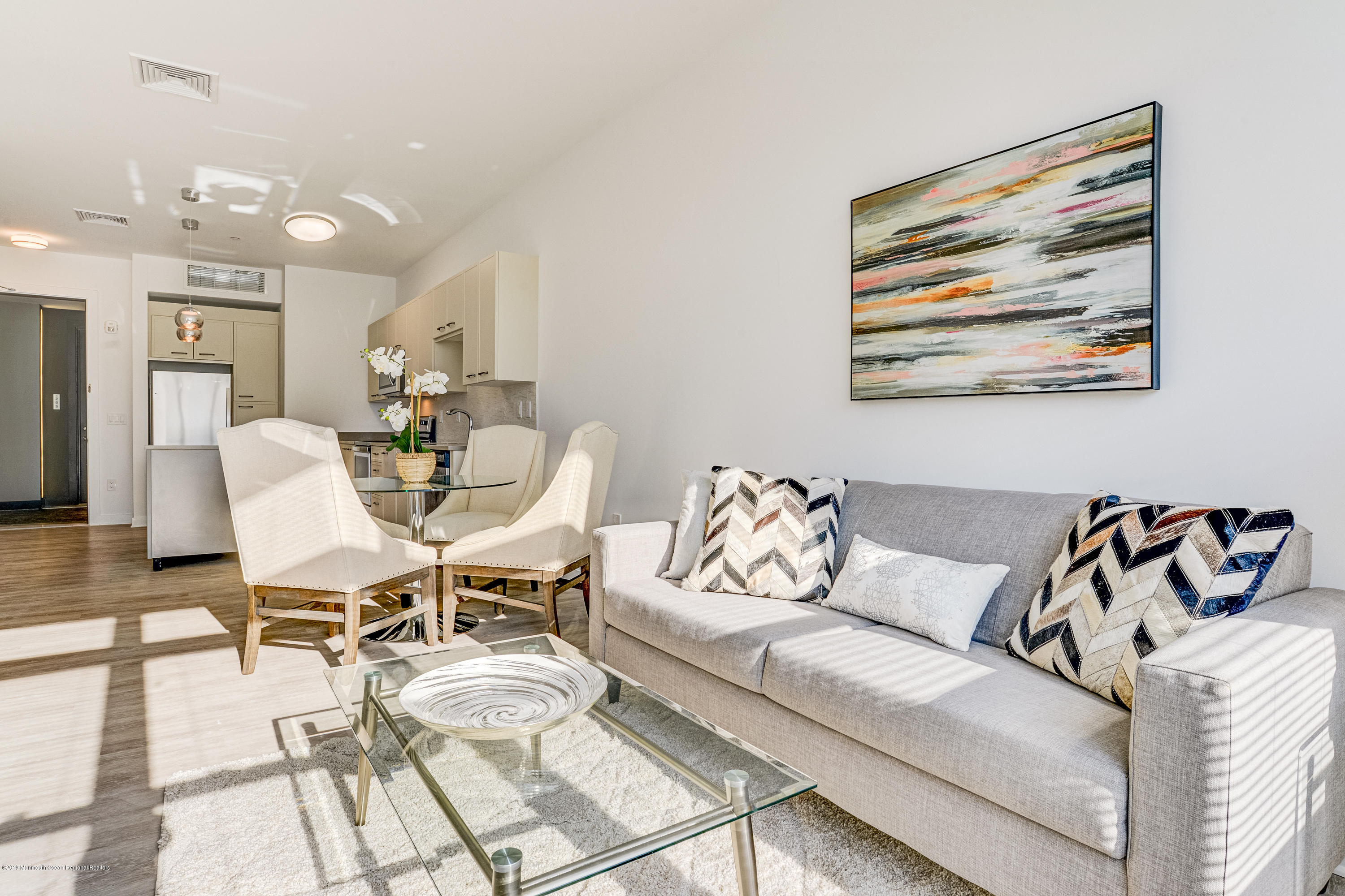 55 West Front Street, Unit 306 Red Bank, NJ 07701 - Photo 11 of 24 a living room with furniture and white walls
