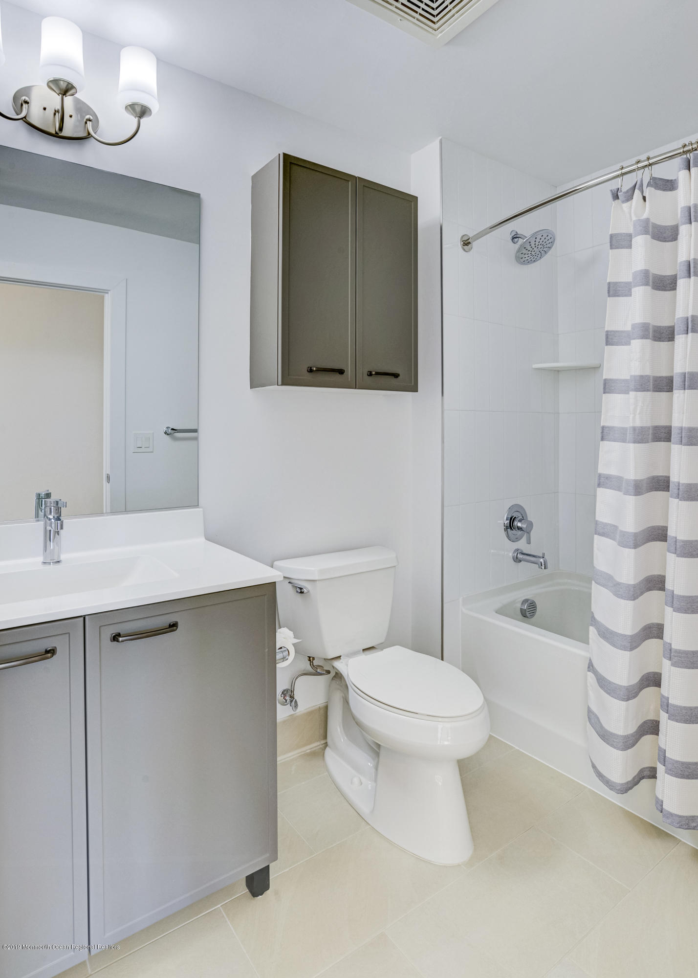 55 West Front Street, Unit 306 Red Bank, NJ 07701 - Photo 16 of 24 a bathroom with a sink toilet and shower