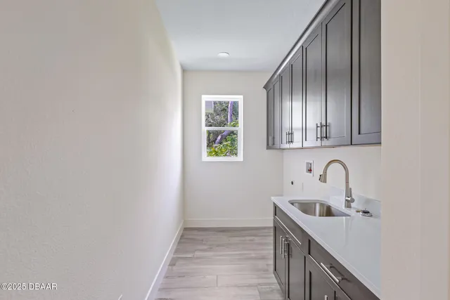 a kitchen with a sink and cabinets