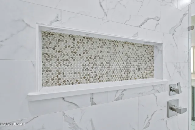 a bathroom with a bathtub and shower