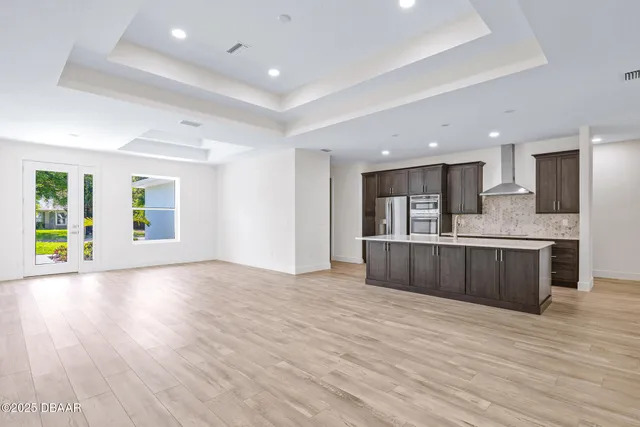 a view of kitchen with wooden floor and window