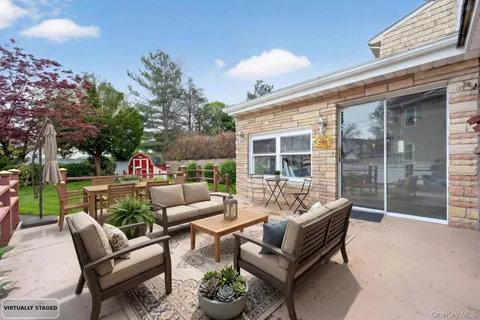 a outdoor living space with furniture and garden view