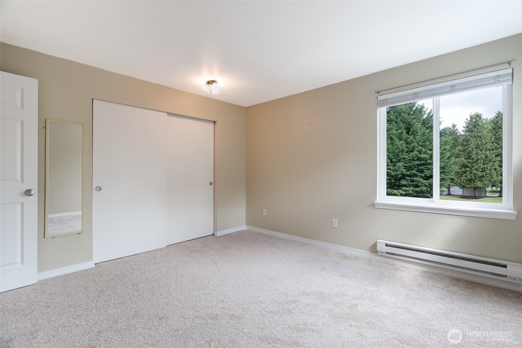 20320 Bothell Everett Highway, Unit D301 Bothell, WA 98012 - Photo 24 of 35 a view of an empty room with a window
