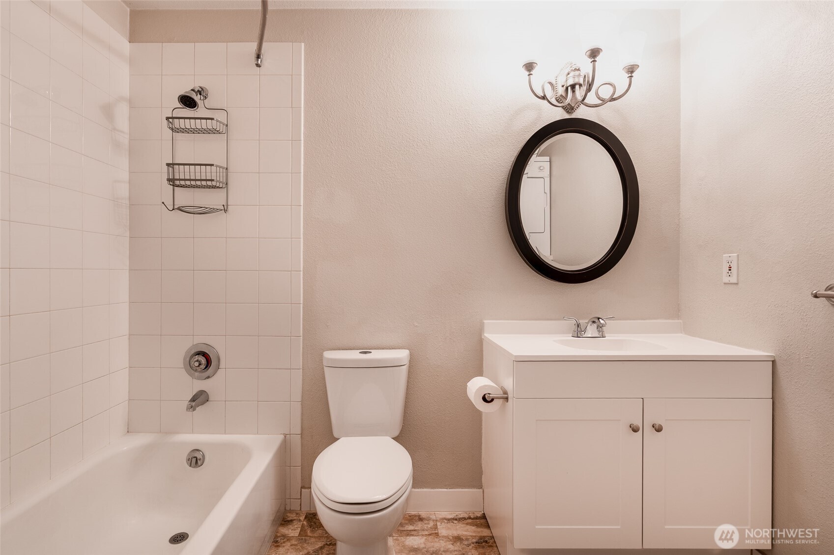 20320 Bothell Everett Highway, Unit D301 Bothell, WA 98012 - Photo 26 of 35 a bathroom with a sink a toilet and a mirror