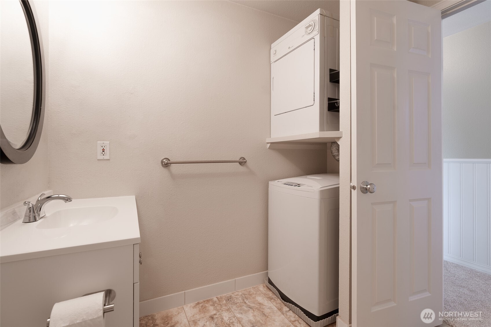 20320 Bothell Everett Highway, Unit D301 Bothell, WA 98012 - Photo 27 of 35 a bathroom with a sink and a mirror