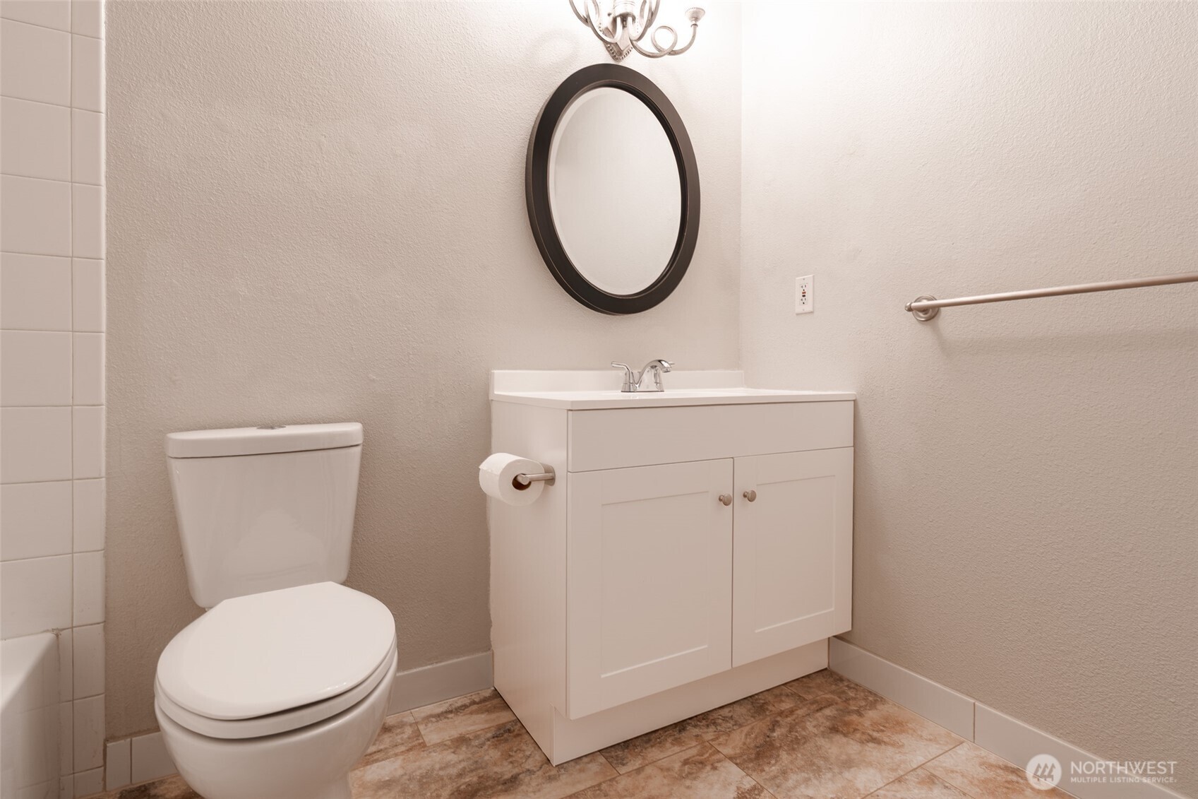 20320 Bothell Everett Highway, Unit D301 Bothell, WA 98012 - Photo 28 of 35 a bathroom with a toilet a sink and a mirror