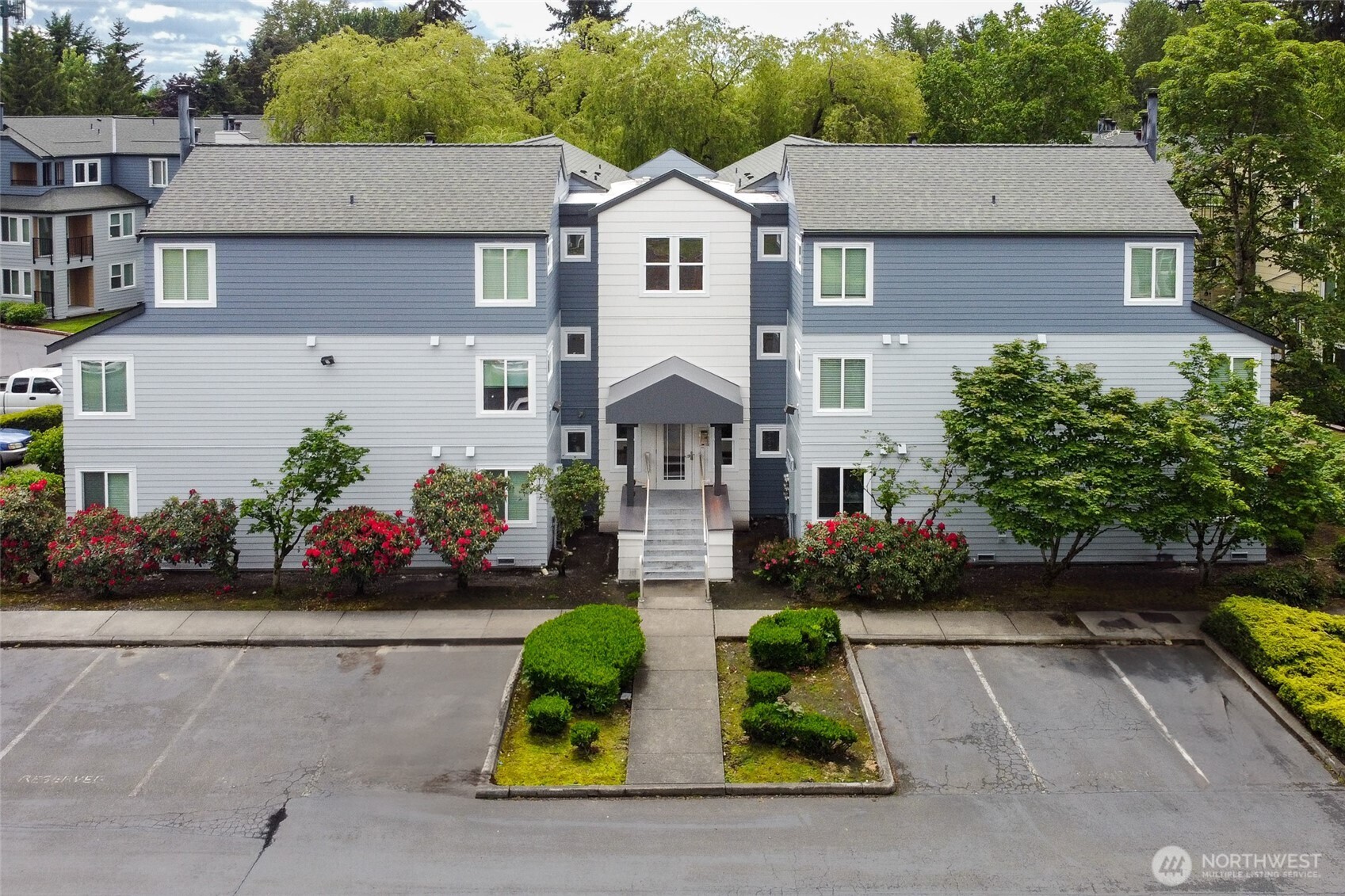 20320 Bothell Everett Highway, Unit D301 Bothell, WA 98012 - Photo 32 of 35 front view of house with a yard