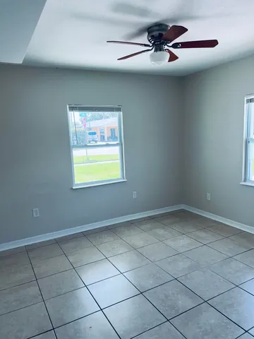 en empty room with windows