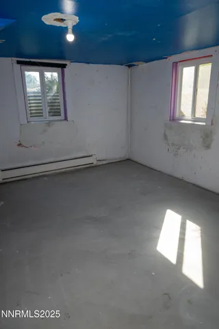 an empty room with windows