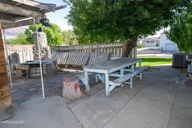 a view of a chairs and table in the patio