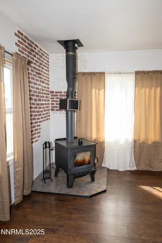 a living room with furniture and large window