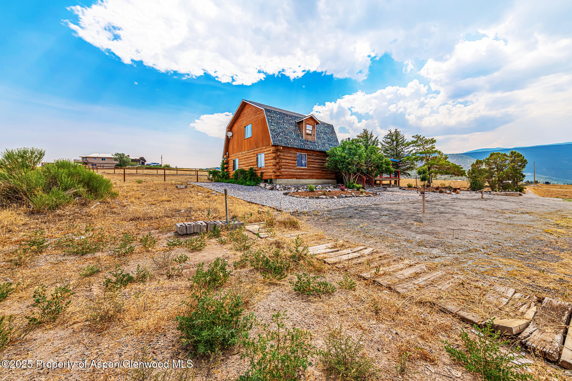 6194 County Road 320 Rifle, CO 81650 - Photo 14 of 54 a view of a wooden house with a yard