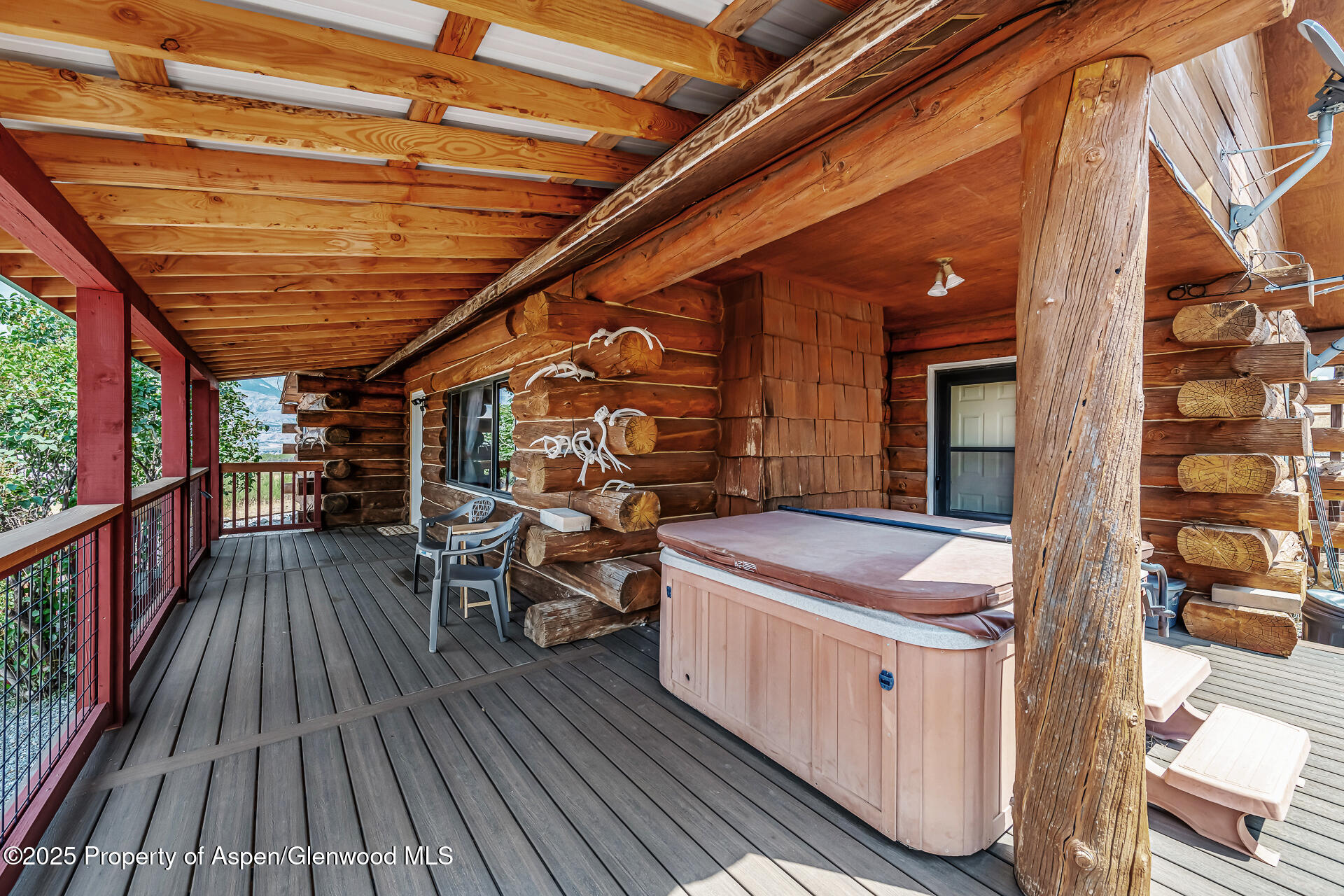 6194 County Road 320 Rifle, CO 81650 - Photo 17 of 54 a view of a balcony with chairs and wooden floor