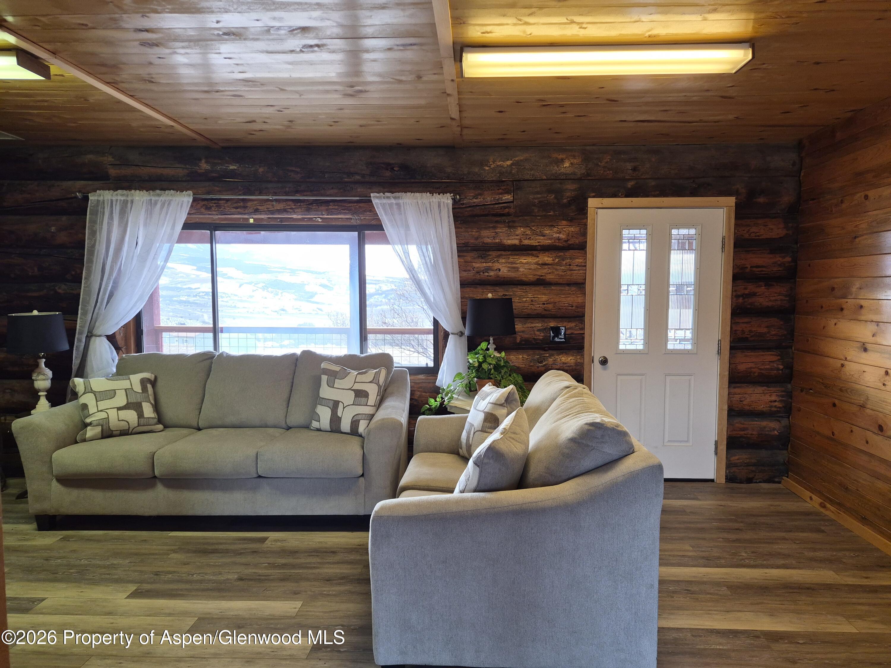 6194 County Road 320 Rifle, CO 81650 - Photo 18 of 54 a living room with furniture and a large window